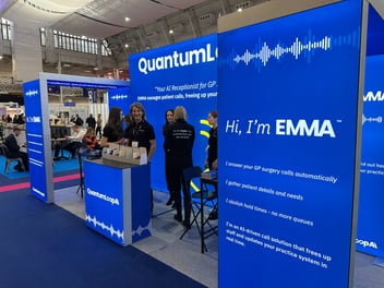 QuantumLoopAI exhibition stand showcasing EMMA, the AI receptionist for GP surgeries, at the Best Practice Birmingham event, highlighting NHS innovations in digital health and patient access.
